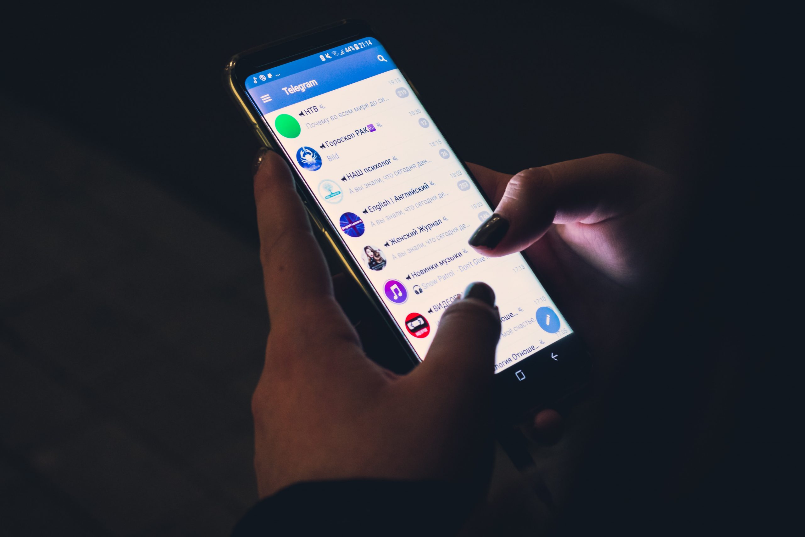 Person using smartphone (Telegram app)